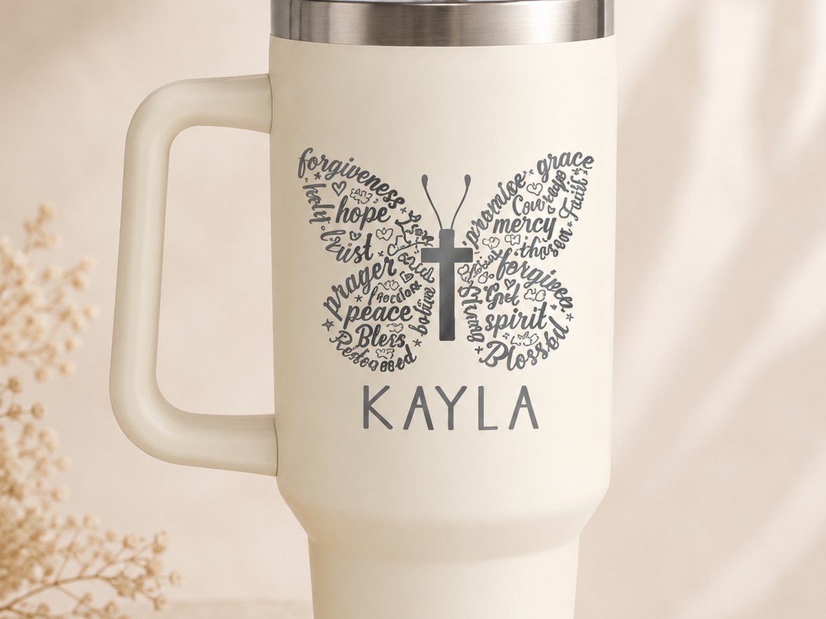 Tumbler with a butterfly made of words and a name underneath