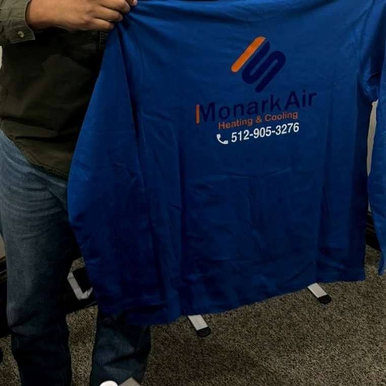 Monark Air branded work shirt with company logo