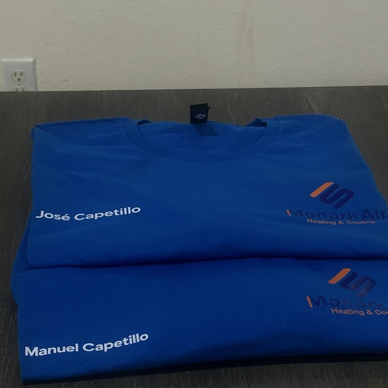 Blue work shirts printed with each employee name
